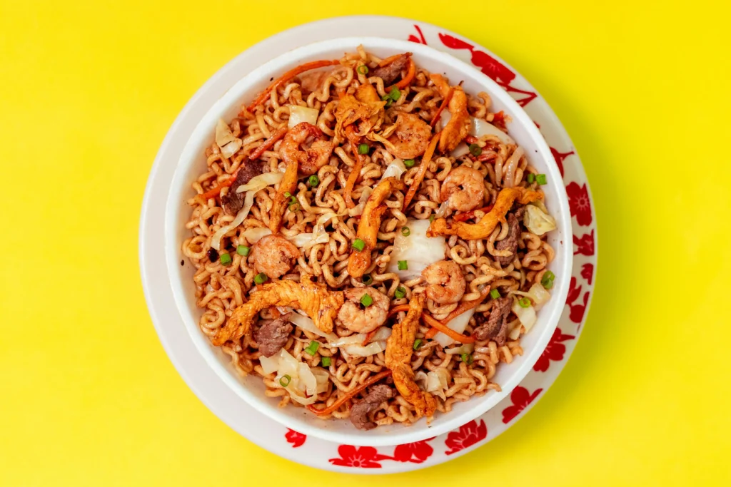 Tom Yum noodle soup with spicy broth, herbs and shrimp