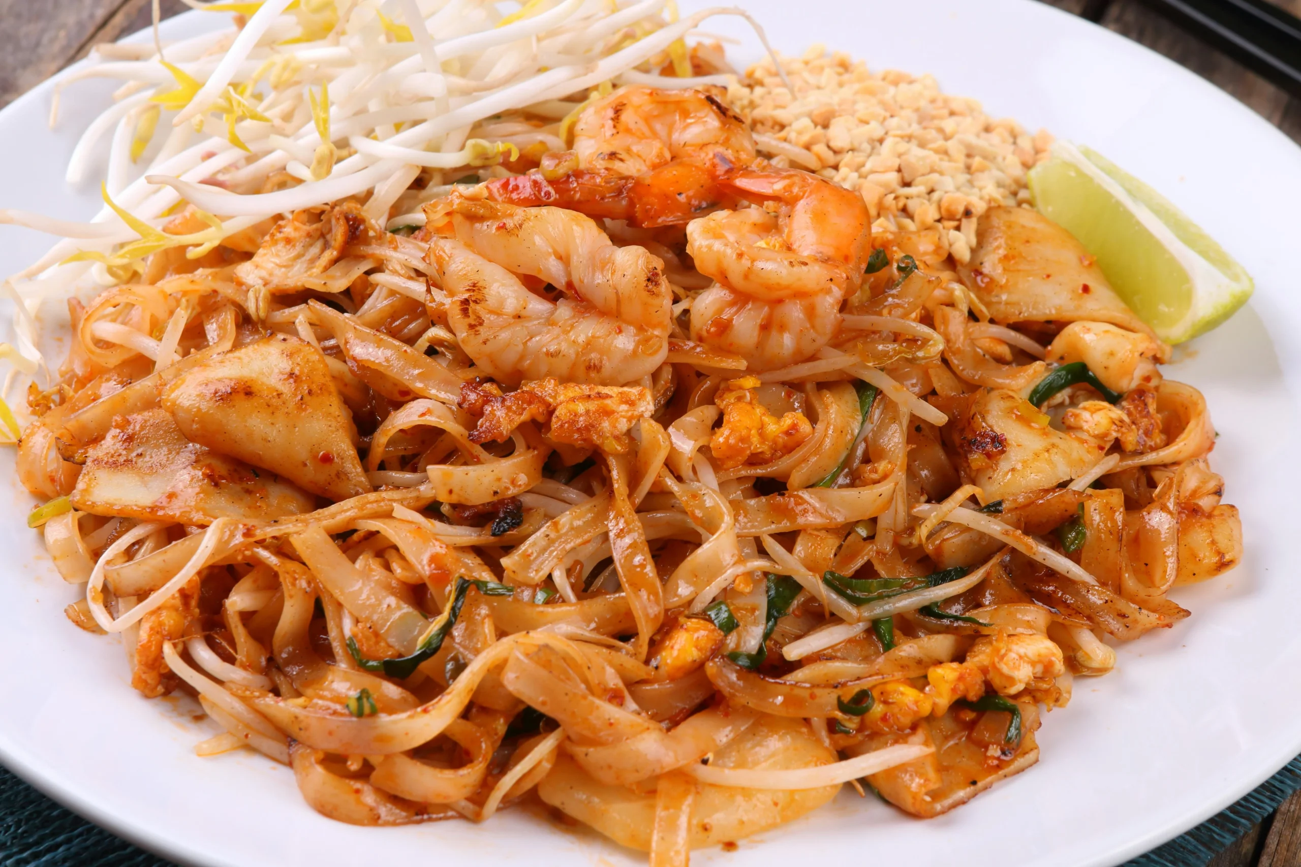 Pad Thai noodles with shrimp, peanuts and lime in Thailand